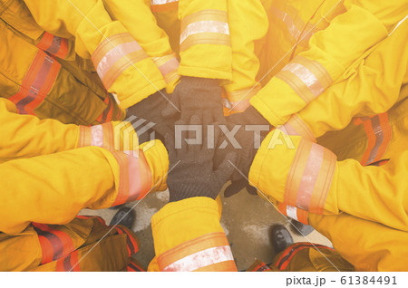 Firefighter Teamwork 61384491