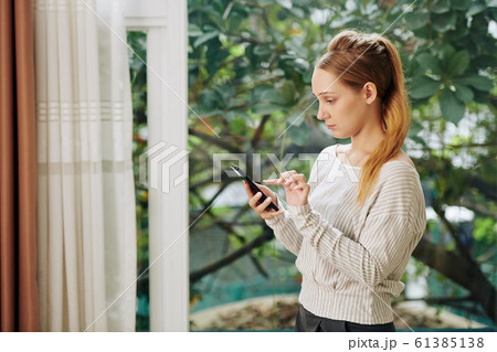 Young Woman Texting Messages 61385138