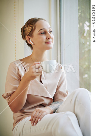 Young Woman Relaxing At Home 61385191