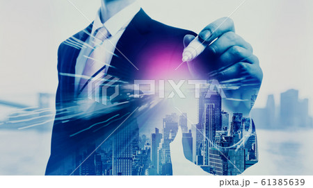 Businessman holding a pen Businessman holding a pen 61385639