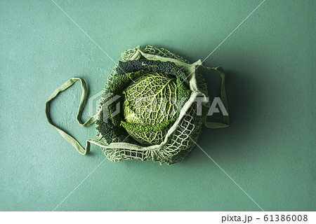 Savoy cabbage in eco-friendly fabric bag. Reusable Savoy cabbage in eco-friendly fabric bag. Reusable 61386008