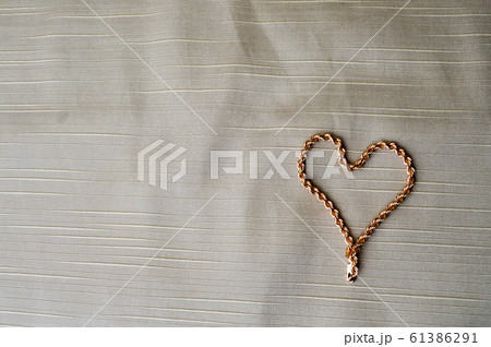 Heart made of a gold chain. Bright, shiny Heart made of a gold chain. Bright, shiny 61386291