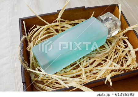 Blue, beautiful, glass bottle with cologne 61386292