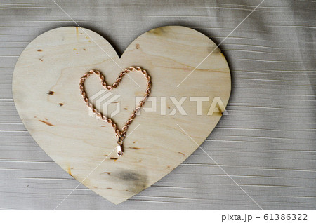 A heart made of a female gold chain A heart made of a female gold chain 61386322