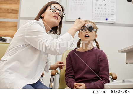 Little Girl at Vision Exam 61387208