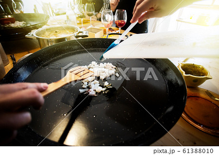Paella ingredients on the pan, This is a traditional Spanish food usually prepared with rice, meat, seafood 61388010
