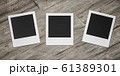 three square blank empty photocards on wooden background 3d render illustration 61389301