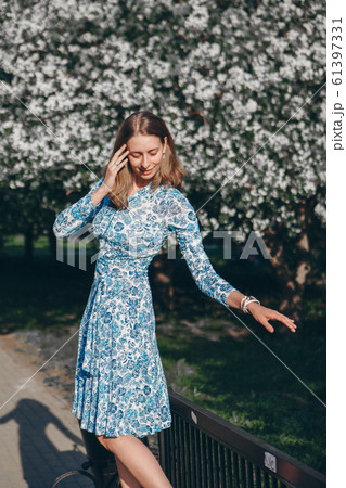 beautiful girl holding flowers. March 8: woman among flowers. the concept of congratulations, women's holidays, natural make up 61397331