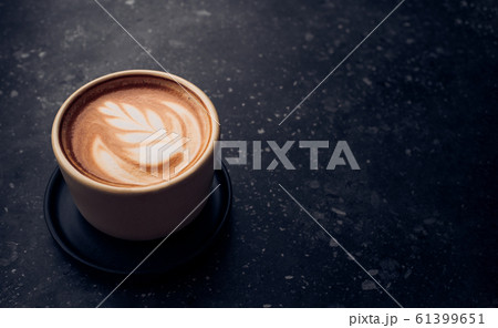 Close up hot capucino coffee cup with latte art 61399651