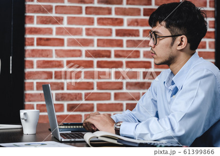 asian businessman woking with laptop and paper 61399866