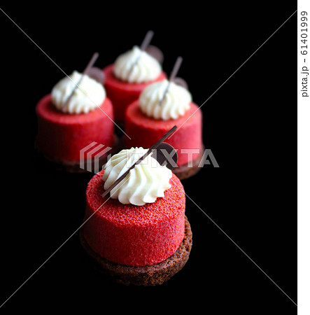Red textured desserts with cream top and chocolate 61401999