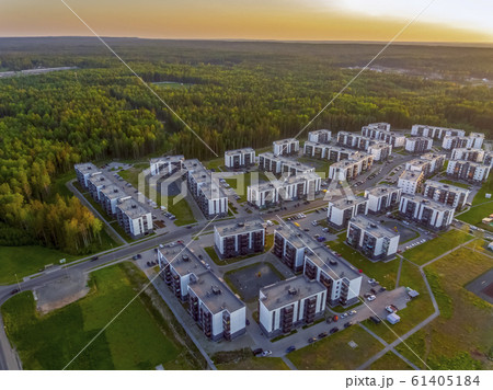 Buildings on city outskirts among pine forest in summer, aerial view Buildings on city outskirts among pine forest in summer, aerial view 61405184
