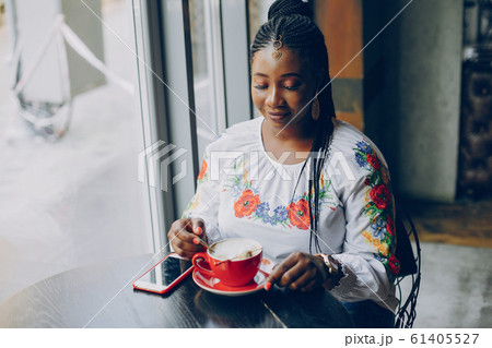 The girl is resting in the cafe The girl is resting in the cafe 61405527