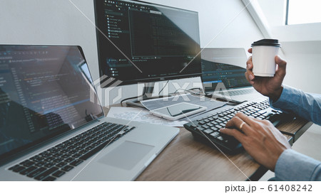 Programmer working On Computer In IT Office Typing Programmer working On Computer In IT Office Typing 61408242