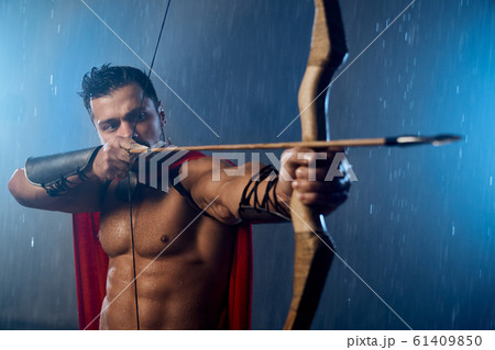 Selective focus of spartan shooting from bow. Selective focus of spartan shooting from bow. 61409850