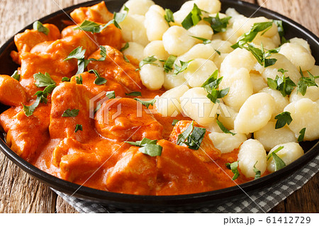 tender pieces of chicken in a fragrant creamy 61412729