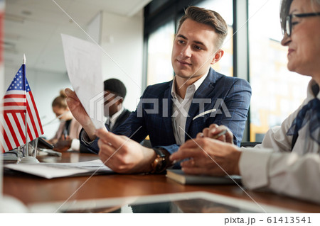 Businessman reading a document Businessman reading a document 61413541