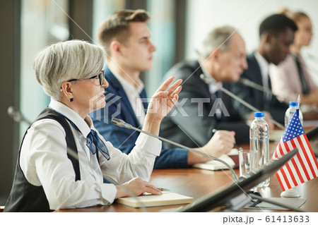 Female political leader at conference 61413633