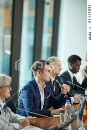 Businessman at press conference Businessman at press conference 61413655