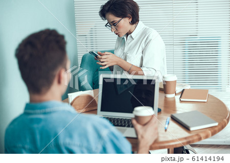 Young employees are sitting in the office Young employees are sitting in the office 61414194