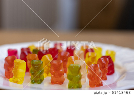Colorful Gummy Bears on white plate close front view Colorful Gummy Bears on white plate close front view 61418468
