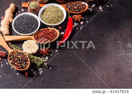 Spices and herbs over black stone background 61427819