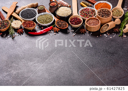 Spices and herbs over black stone background Spices and herbs over black stone background 61427825