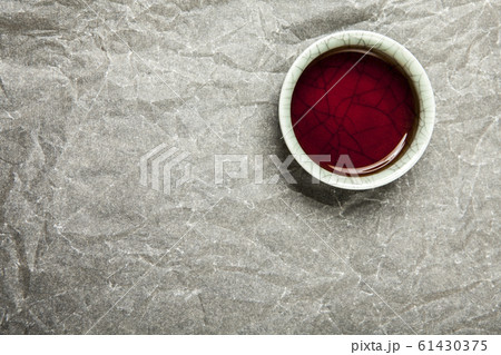black tea cup paper background  61430375