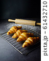 Freshly baked croissants on the table, served with fresh milk    61432710