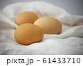 Lay eggs to prepare food on a white cloth on the table, Eggs for cooking, Food ingredients. 61433710