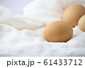 Lay eggs to prepare food on a white cloth on the table, Eggs for cooking, Food ingredients. 61433712