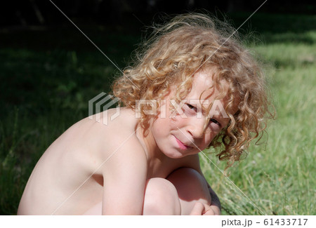 Portrait of a little blond boy, outside Portrait of a little blond boy, outside 61433717