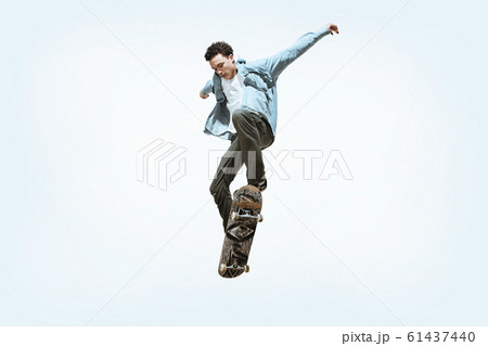 Caucasian young skateboarder riding isolated on a white background Caucasian young skateboarder riding isolated on a white background 61437440