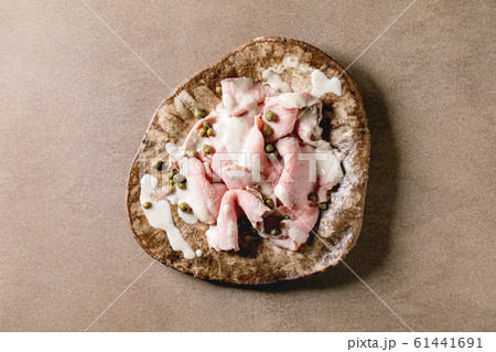 Vitello tonnato sliced veal Vitello tonnato sliced veal 61441691