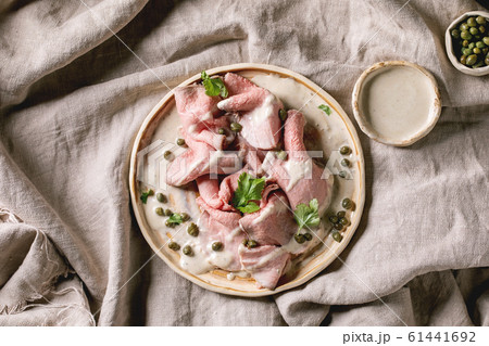 Vitello tonnato sliced veal Vitello tonnato sliced veal 61441692