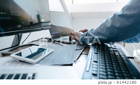 Programmer working On Computer In IT Office Typing 61442180