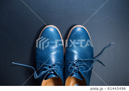 Blue men's leather shoes on dark background Blue men's leather shoes on dark background 61443496