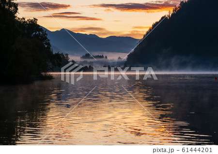 Peaceful autumn Alps mountain lake. Sunrise 61444201