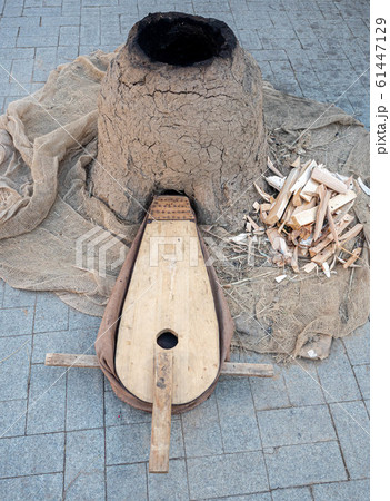 Old woodworking hand tool: wooden plane, chisel ax, sledgehammer, hammer and in a carpentry workshop on dirty rustic table covered with sawdust background side view Old woodworking hand tool: wooden plane, chisel ax, sledgehammer, hammer and in a carpentry workshop on dirty rustic table covered with sawdust background side view 61447129