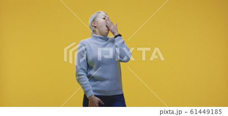 Young woman yawning Young woman yawning 61449185