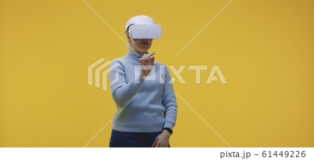 Woman wearing VR headset Woman wearing VR headset 61449226