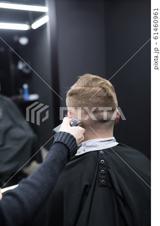 Haircut men typewriter close-up. Barber cuts a man. 61460961