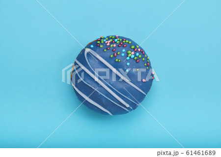 Blue sweet donut on a blue background. Concept blue on blue, mnimalism, sweet desserts. copy space blue background 61461689