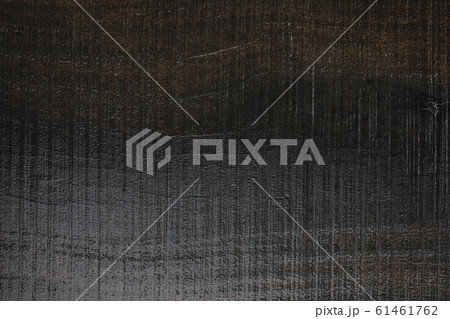 A wet black lumber wood with saw scratch texture A wet black lumber wood with saw scratch texture 61461762