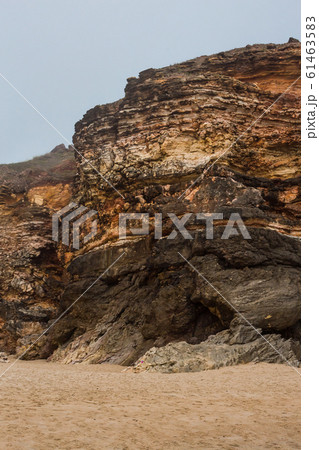 Beach of Nazare, Portugal. Cliff and sand Beach of Nazare, Portugal. Cliff and sand 61463583