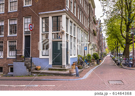 Amsterdam canal street scene 61464368