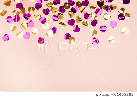 Colorful heart confetti on a background. 61465289