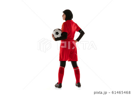 Arabian female soccer or football player isolated on white studio background 61465468