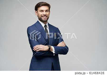 studio photo of young handsome stylish businessman wearing suit studio photo of young handsome stylish businessman wearing suit 61468426