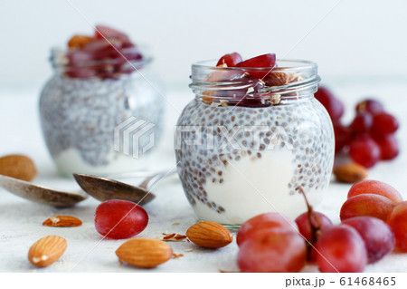 Chia pudding parfait with red grapes and almonds 61468465